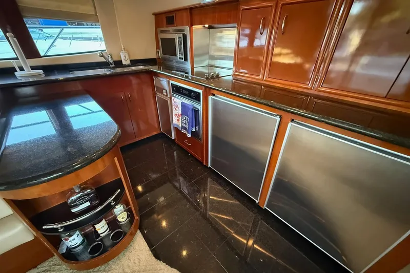 Slide: The Image of Luxurious kitchen interior of 2006 Carver 56 Voyager yacht with modern appliances. - 10
