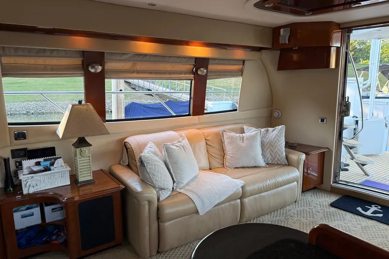 Slide: The Image of Luxurious interior of a 2006 Carver 56 Voyager yacht with plush seating and elegant decor. - 13
