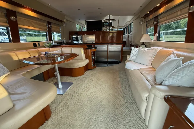 Slide: The Image of Luxurious interior of a 2006 Carver 56 Voyager yacht with elegant seating and modern amenities. - 15