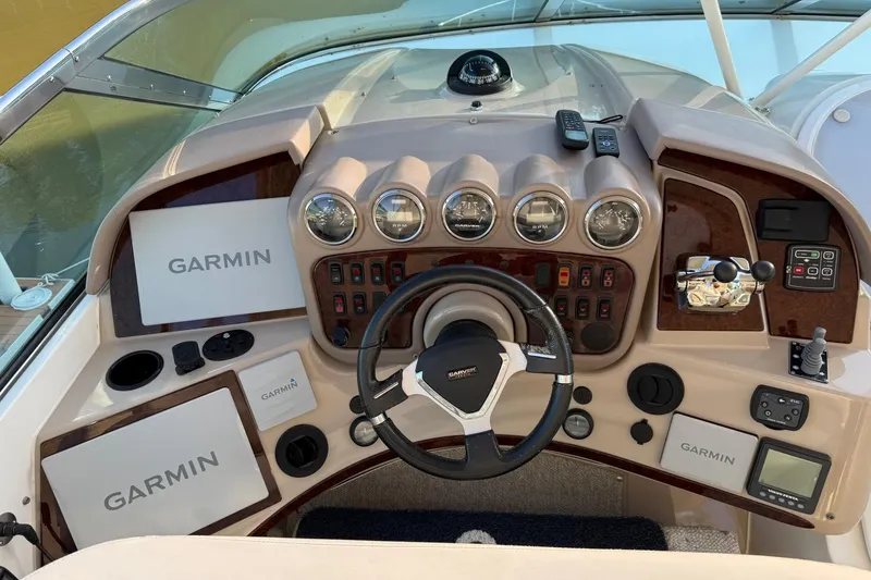 Slide: The Image of Helm of 2006 Carver 56 Voyager with Garmin navigation displays and control panel. - 18