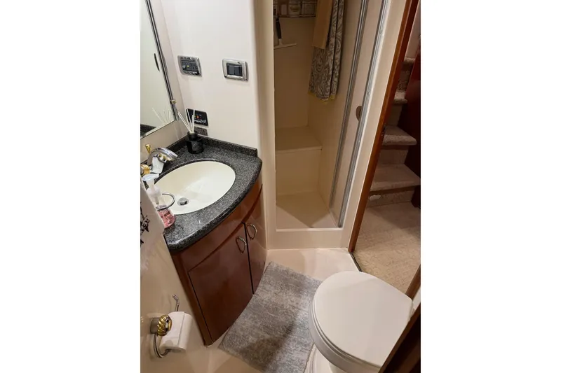 Slide: The Image of Bathroom interior of 2006 Carver 56 Voyager yacht with sink, shower, and toilet. - 21