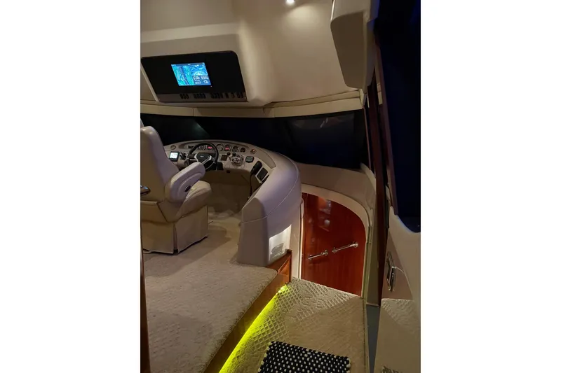 Slide: The Image of 2006 Carver 56 Voyager yacht helm with modern controls and luxurious interior design. - 9
