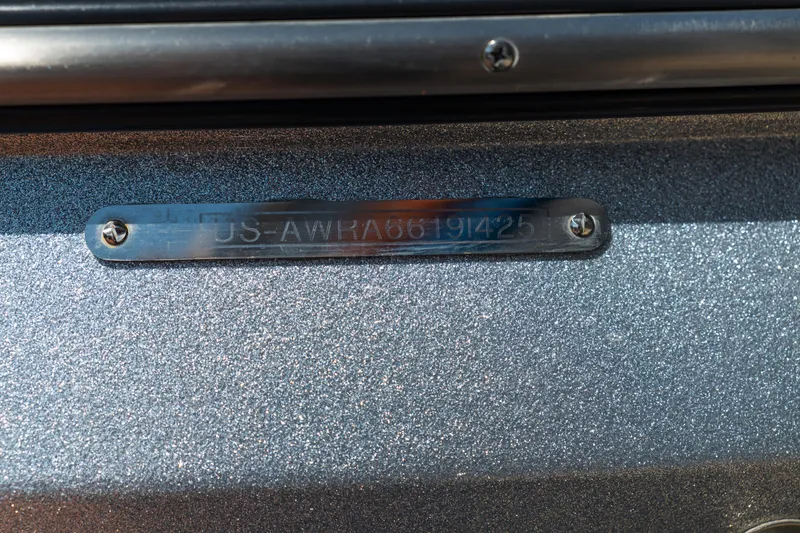 Slide: The Image of 2025 Axis A225 boat identification plate on metallic surface. - 11