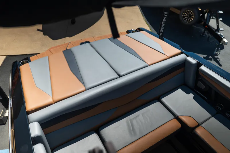 Slide: The Image of Luxurious seating on 2025 Axis A225 boat, featuring sleek brown and gray upholstery. - 14