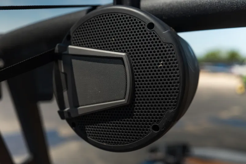 Slide: The Image of Close-up of a 2025 Axis A225 boat speaker, featuring a sleek black grille design. - 16