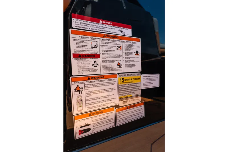 Slide: The Image of Safety warning labels on Axis A225 boat, detailing maximum capacities and operational hazards. - 21