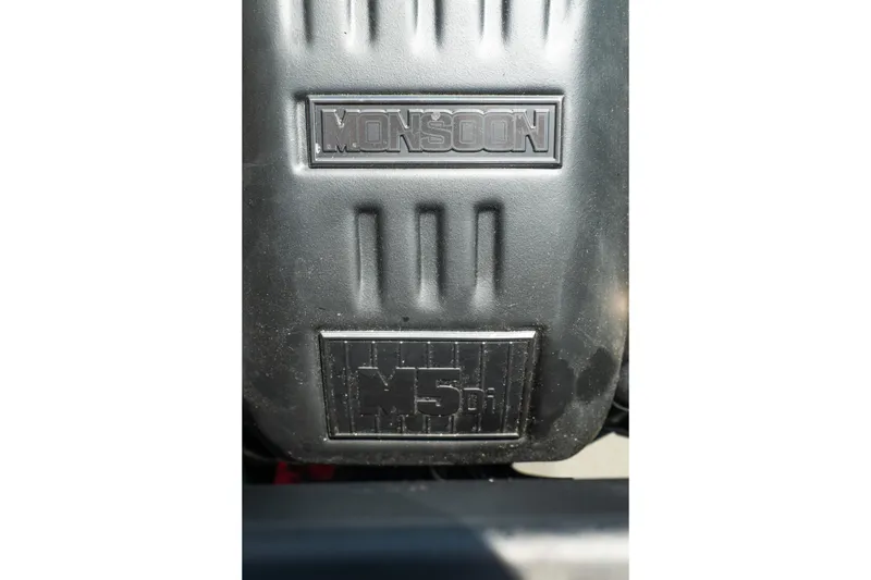 Slide: The Image of Close-up of Axis A225 2025 Monsoon engine cover with embossed logo. - 24