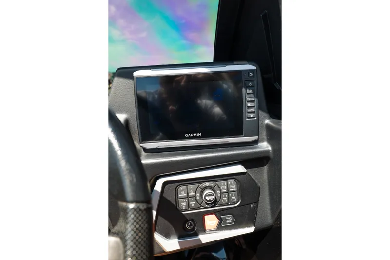 Slide: The Image of Dashboard of 2025 Axis A225 with Garmin display and control panel. - 26