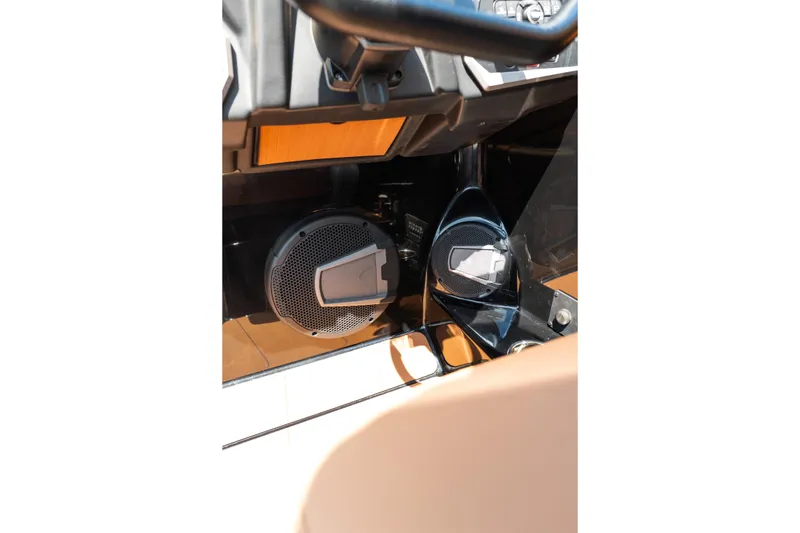 Slide: The Image of 2025 Axis A225 boat interior with speaker system and dashboard details. - 29