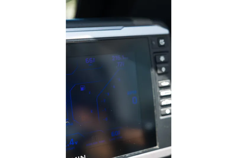 Slide: The Image of Close-up of 2025 Axis A225 dashboard display with digital controls and indicators. - 34