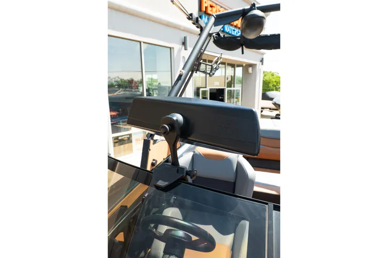 Slide: The Image of 2025 Axis A225 boat dashboard with steering wheel and rearview mirror. - 35