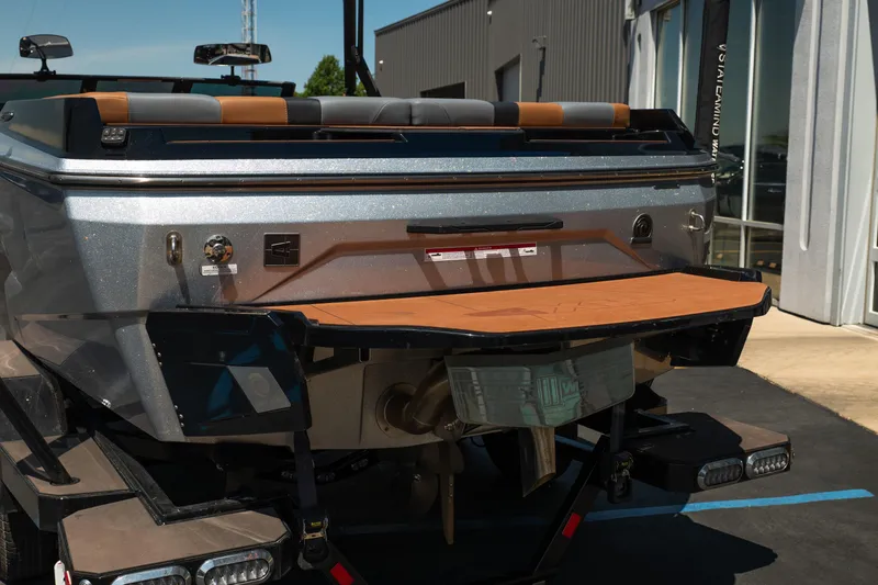 Slide: The Image of Rear view of 2025 Axis A225 boat with swim platform and modern design. - 5