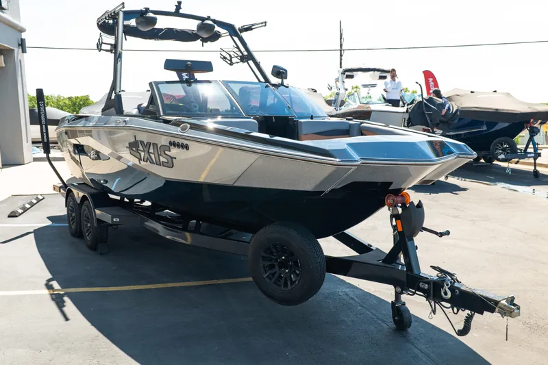Slide: The Image of 2025 Axis A225 boat on trailer in outdoor showroom. - 9