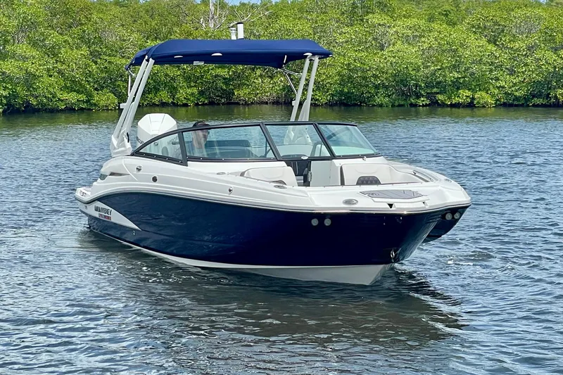 The Image of 2024 Monterey M-45 boat cruising on a serene lake with lush greenery. - 0