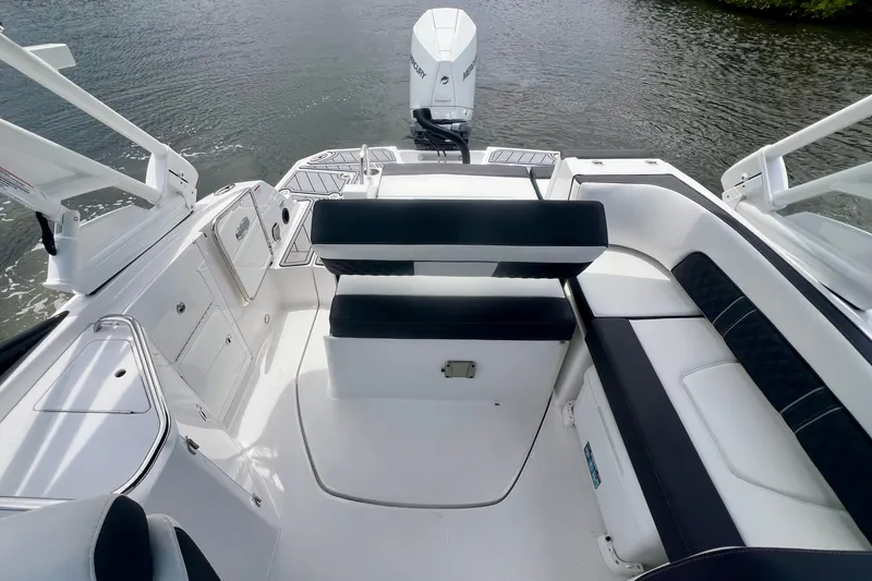 Slide: The Image of 2024 Monterey M-45 boat interior with sleek seating and modern design on the water. - 15