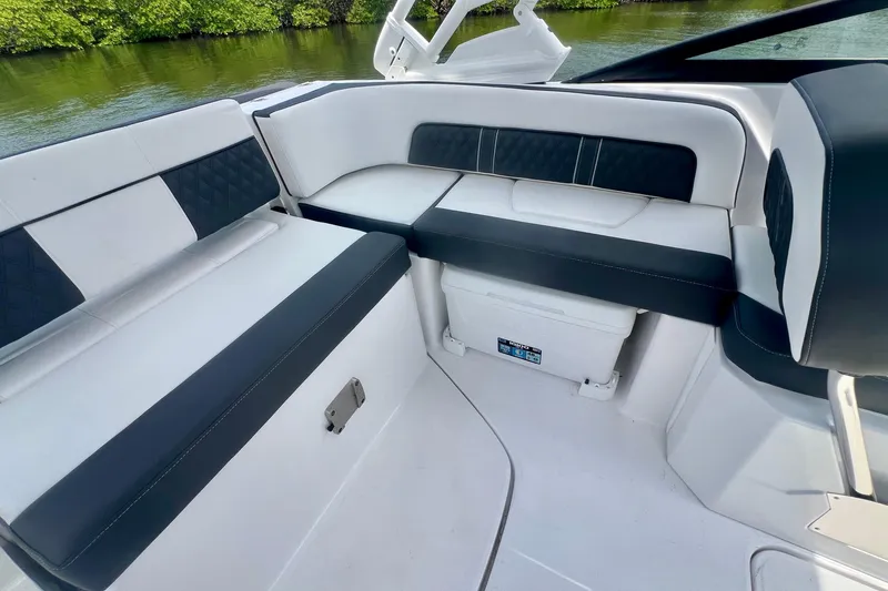 Slide: The Image of Luxurious seating area on 2024 Monterey M-45 boat, featuring sleek black and white upholstery. - 16
