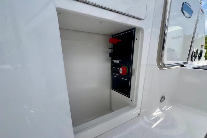 Slide: The Image of 2024 Monterey M-45 boat compartment with control panel and safety features. - 18