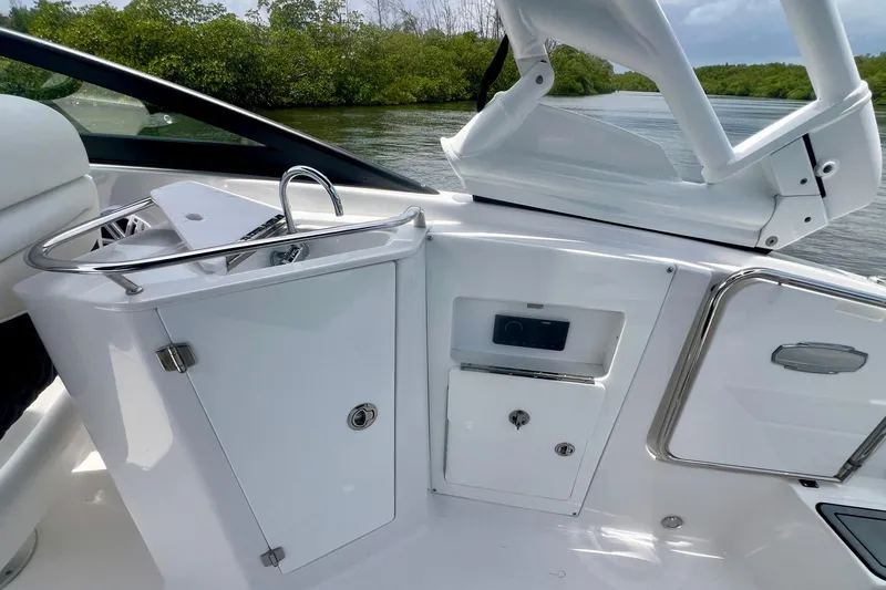 Slide: The Image of 2024 Monterey M-45 boat interior with sleek white cabinetry and stainless steel accents. - 19