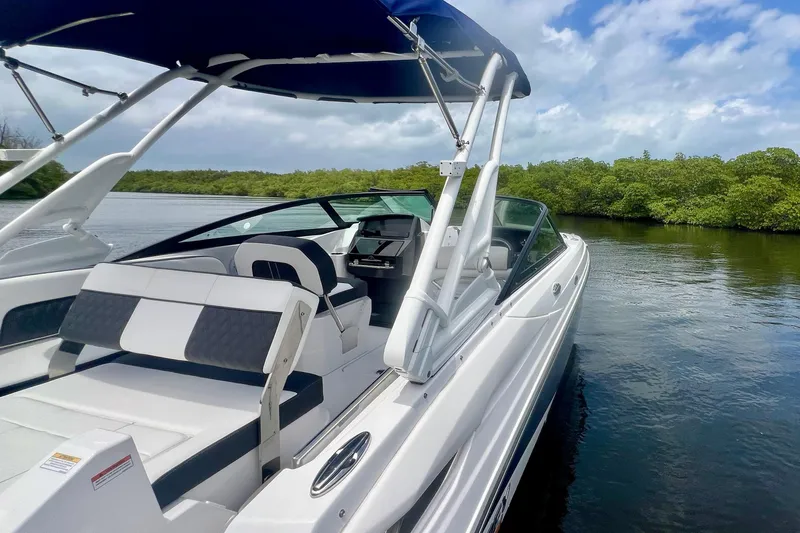 Slide: The Image of 2024 Monterey M-45 boat with sleek design, docked on a serene waterway. - 20