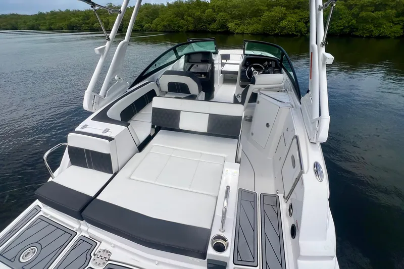 Slide: The Image of 2024 Monterey M-45 boat with sleek seating and modern design on calm water. - 21