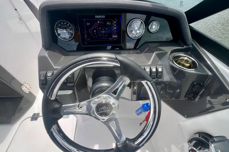 Slide: The Image of 2024 Monterey M-45 boat dashboard with steering wheel and digital display. - 4
