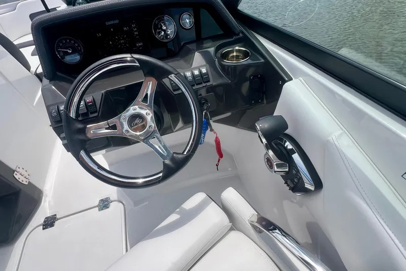 Slide: The Image of 2024 Monterey M-45 boat cockpit with steering wheel and control panel. - 5
