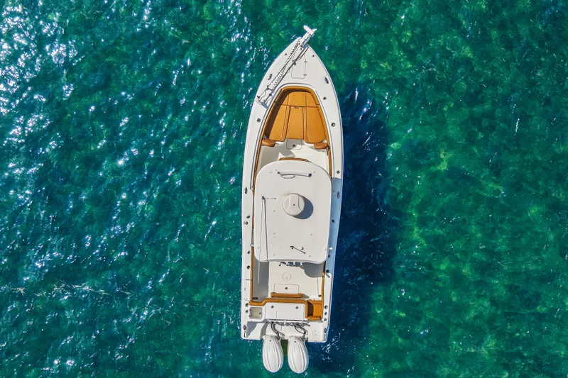 Slide: The Image of Aerial view of 2022 Sea Hunt Gamefish 30 boat on clear turquoise water. - 10