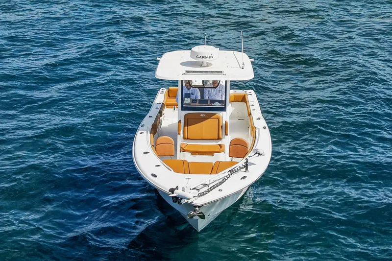 Slide: The Image of 2022 Sea Hunt Gamefish 30 boat with forward seating on open water. - 11