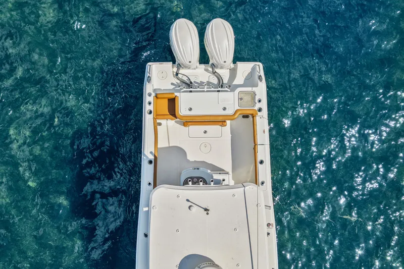 Slide: The Image of Overhead view of 2022 Sea Hunt Gamefish 30 boat on clear blue water. - 13