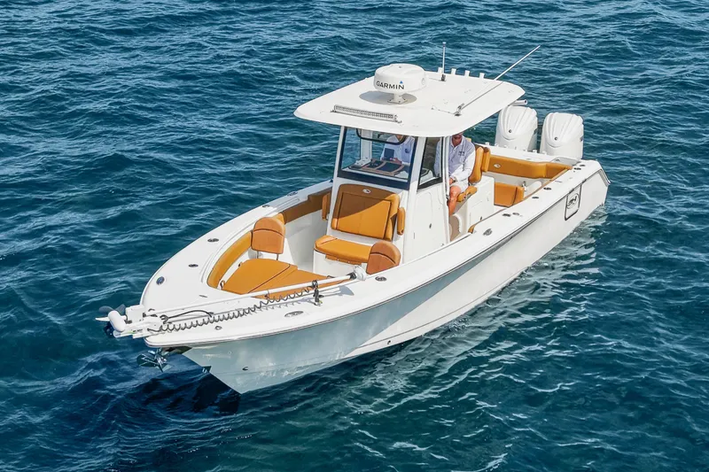 Slide: The Image of 2022 Sea Hunt Gamefish 30 boat with forward seating on open water. - 15