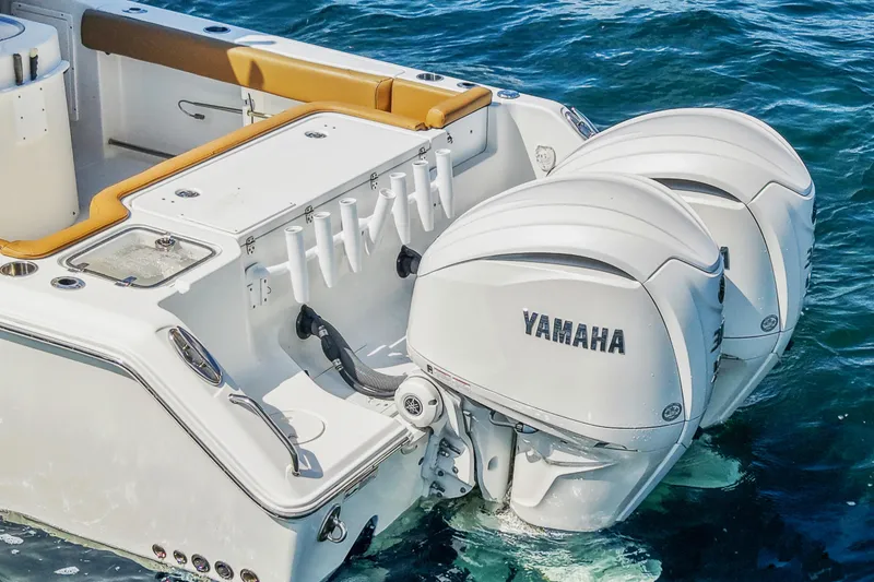 Slide: The Image of 2022 Sea Hunt Gamefish 30 with Yamaha outboard motors on blue water. - 16