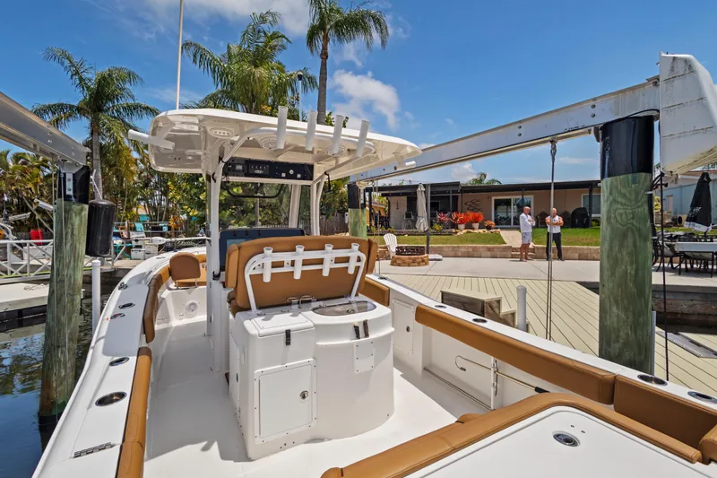 Slide: The Image of 2022 Sea Hunt Gamefish 30 boat docked, featuring forward seating and modern amenities. - 21