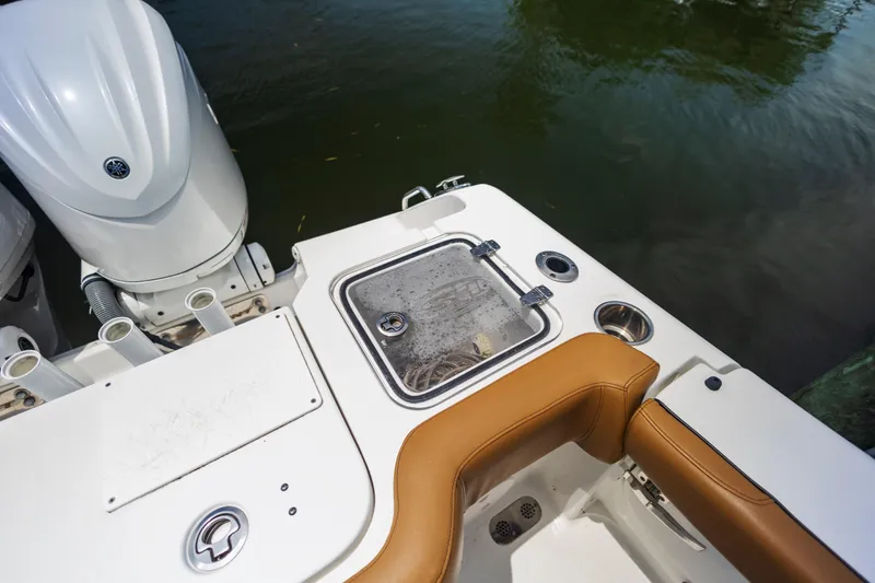Slide: The Image of 2022 Sea Hunt Gamefish 30 boat with seating and engine detail. - 26