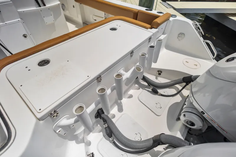 Slide: The Image of 2022 Sea Hunt Gamefish 30 boat with rod holders and seating area. - 27
