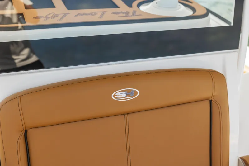 Slide: The Image of 2022 Sea Hunt Gamefish 30 Forward Seating, tan leather seat detail. - 30
