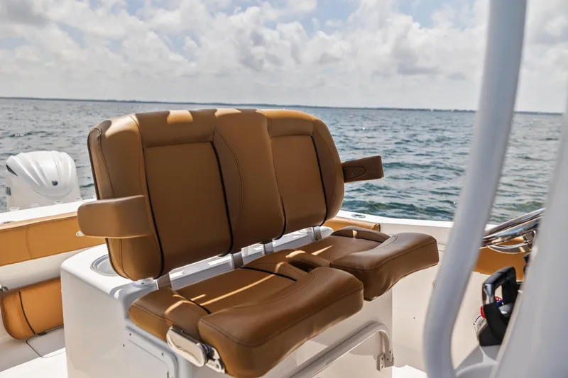 Slide: The Image of 2022 Sea Hunt Gamefish 30 boat with tan forward seating, ocean view in background. - 35