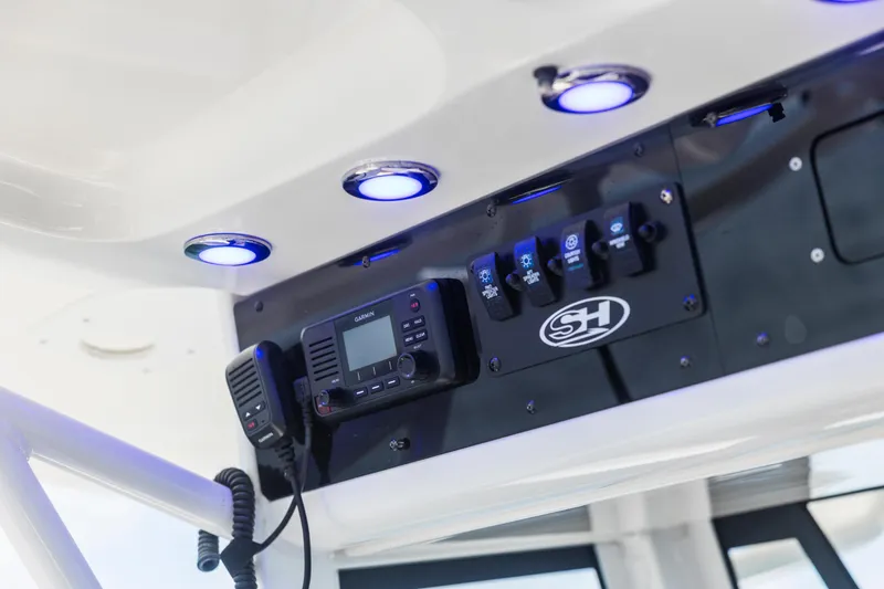 Slide: The Image of Control panel of 2022 Sea Hunt Gamefish 30 boat with illuminated switches. - 42