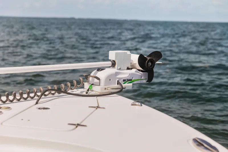 Slide: The Image of 2022 Sea Hunt Gamefish 30 boat with trolling motor on open water. - 43