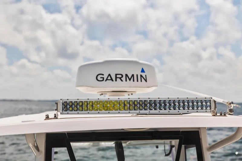 Slide: The Image of 2022 Sea Hunt Gamefish 30 with Garmin radar and LED light bar on open water. - 44