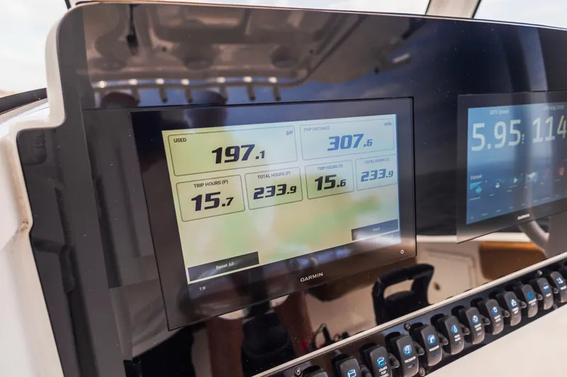 Slide: The Image of Garmin display on 2022 Sea Hunt Gamefish 30 boat dashboard showing trip data. - 47