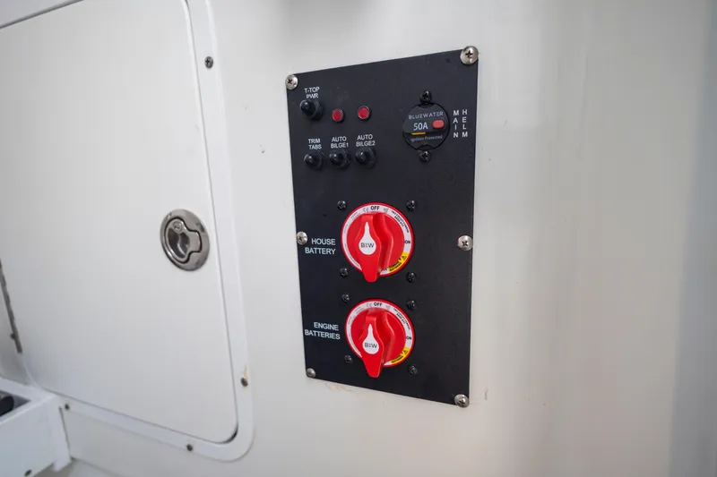 Slide: The Image of Control panel on 2022 Sea Hunt Gamefish 30 boat with battery switches. - 51