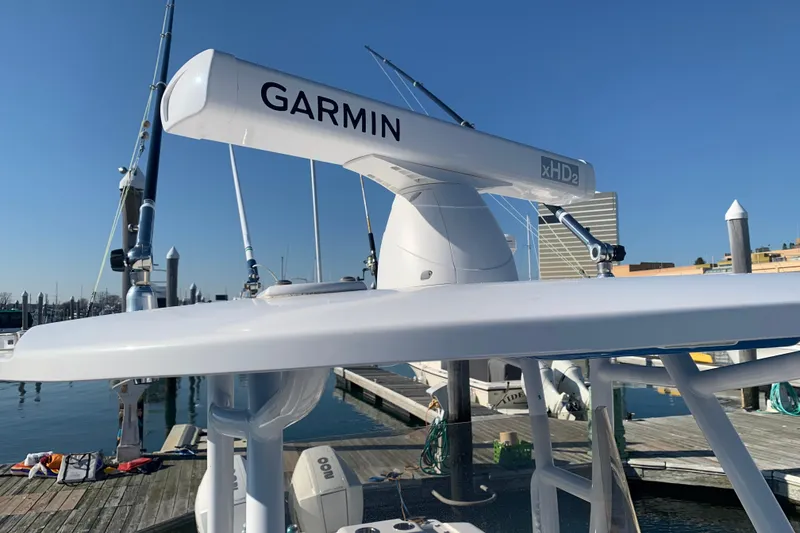 Slide: The Image of 2020 Belzona 27 CC boat with Garmin xHD2 radar at marina dock. - 14