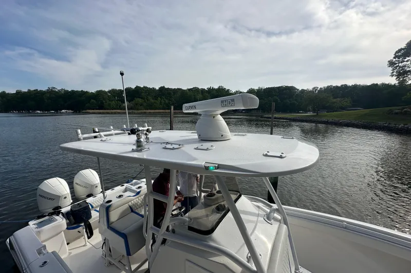 Slide: The Image of 2020 Belzona 27 CC boat with Garmin radar on calm water. - 15