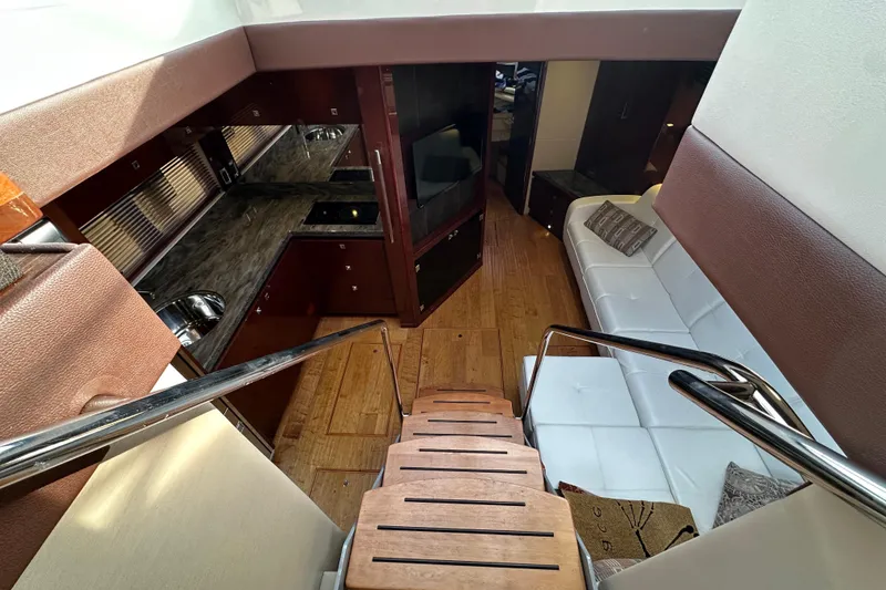Slide: The Image of Luxurious interior of 2014 Sea Ray Sundancer 510 yacht with modern kitchen and seating area. - 17