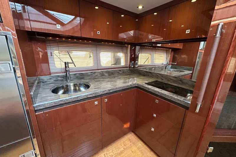 Slide: The Image of Luxurious kitchen interior of 2014 Sea Ray Sundancer 510 yacht with sleek countertops. - 19