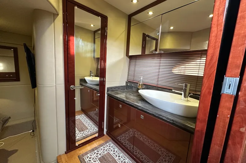 Slide: The Image of Luxurious bathroom interior of 2014 Sea Ray Sundancer 510 yacht with modern sink and wood accents. - 24