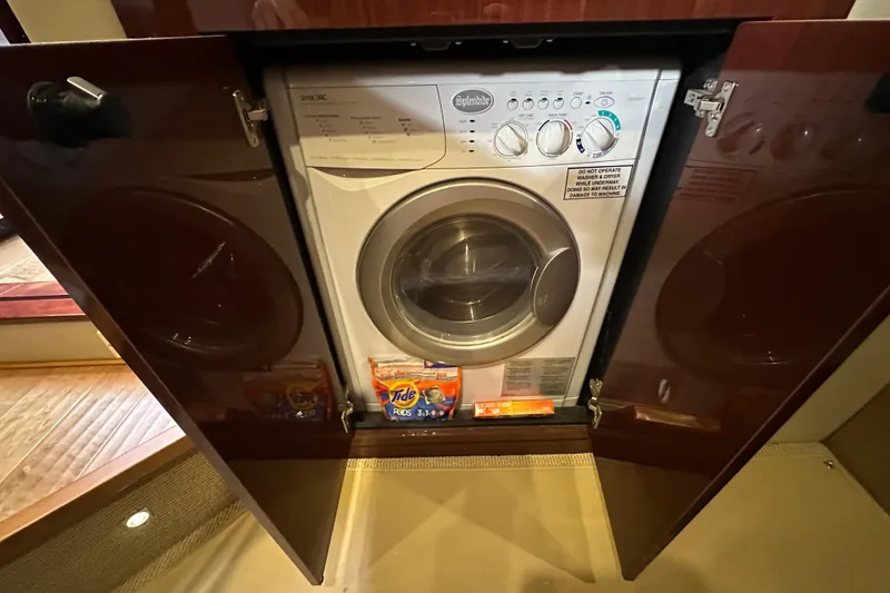 Slide: The Image of Laundry area with washer in 2014 Sea Ray Sundancer 510 yacht. - 27