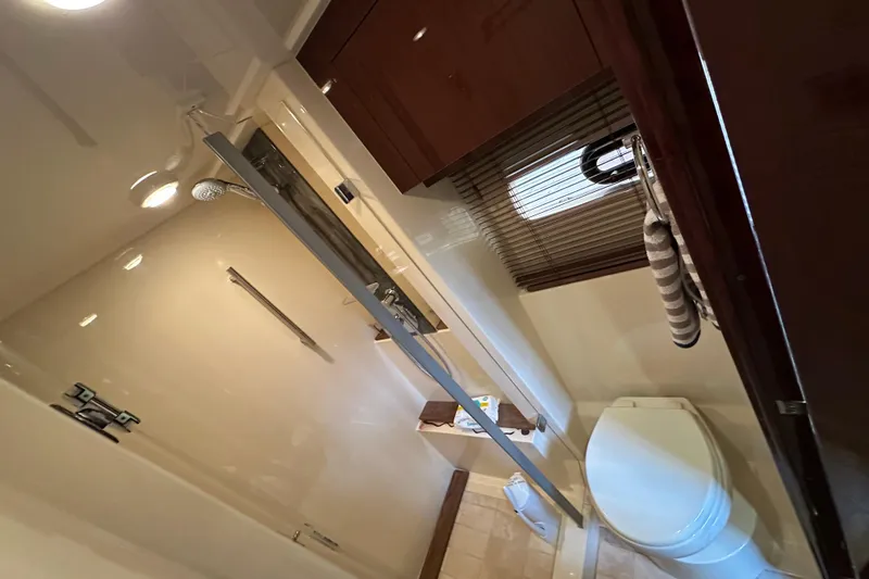 Slide: The Image of Luxurious bathroom interior of 2014 Sea Ray Sundancer 510 yacht with shower and toilet. - 28