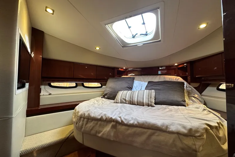 Slide: The Image of Luxurious 2014 Sea Ray Sundancer 510 cabin interior with plush bedding and elegant lighting. - 30