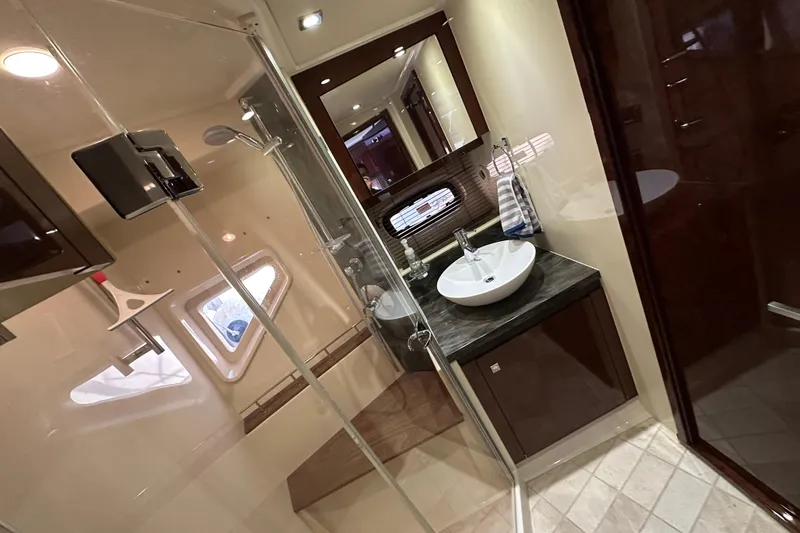 Slide: The Image of Luxurious bathroom interior of 2014 Sea Ray Sundancer 510 yacht, featuring modern fixtures and elegant design. - 34
